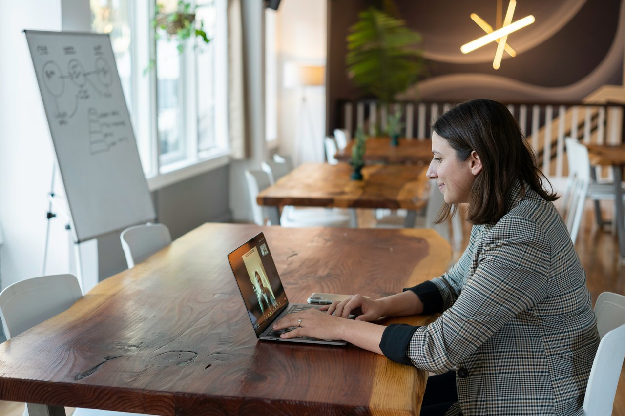 A lady using her laptop to make a video call